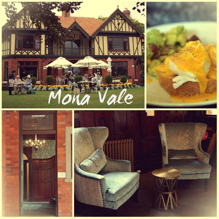 Exterior view of the restored Mona Vale homestead with people dining outside.