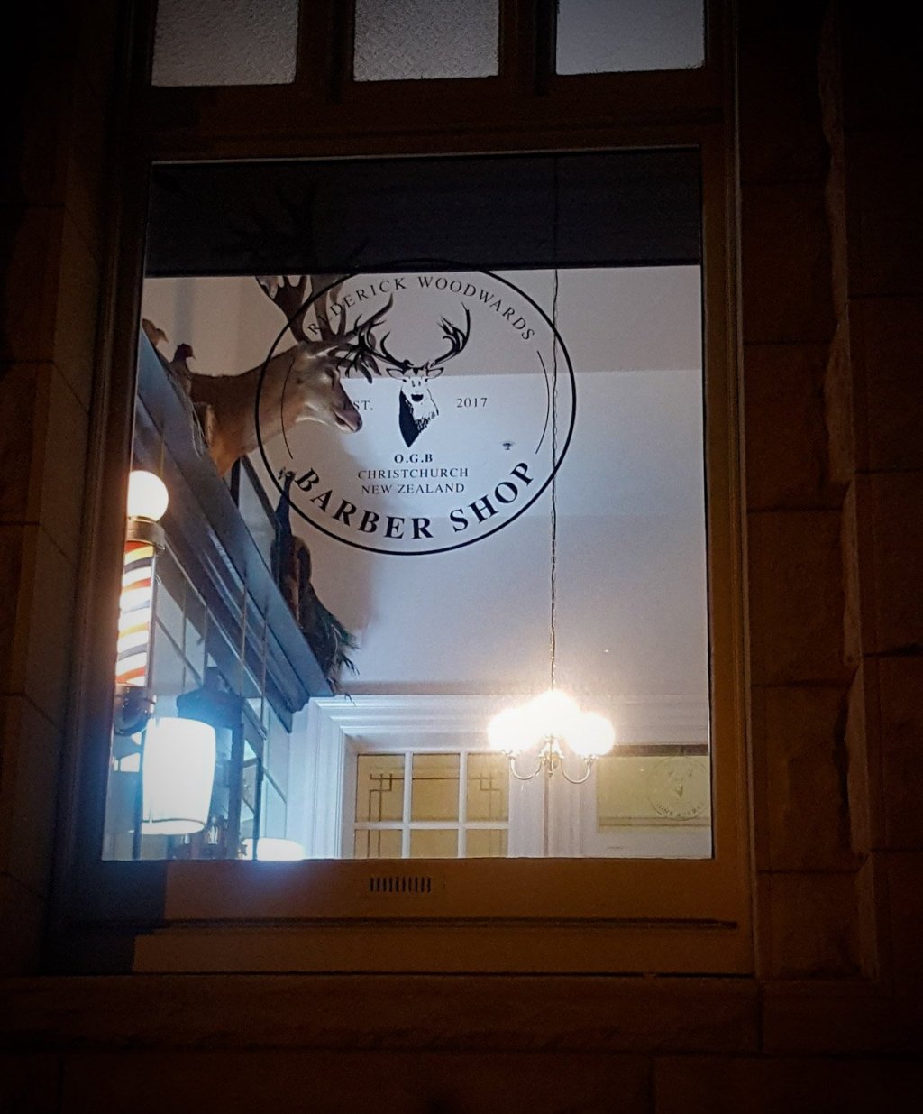 Barbershop window at&nbsp;night