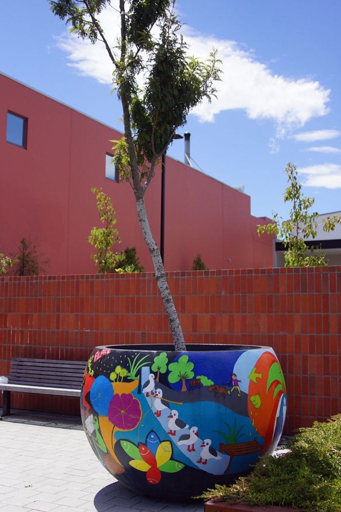 Colourful decorated tree container in&nbsp;Woolston
